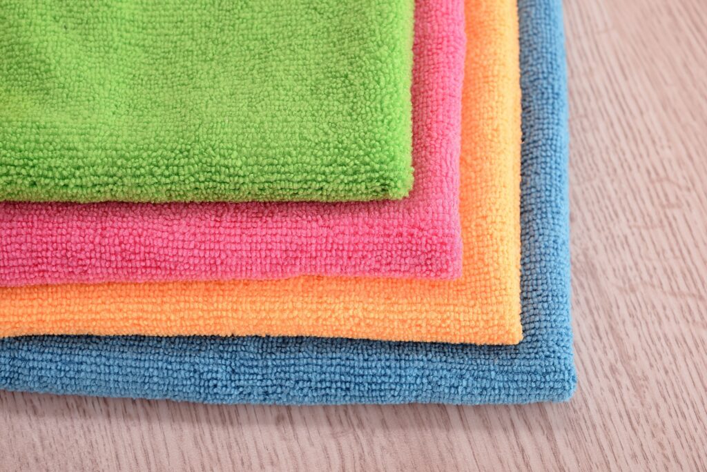 four overlapping colored microfiber cloths